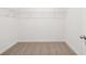 Walk-in closet featuring wire shelving and neutral carpeting, offering ample storage and organization options at 1269 Pj East Rd, Covington, GA 30014