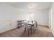 Well-lit dining area with neutral walls, and stylish furnishings, ideal for gatherings and meals at 1269 Pj East Rd, Covington, GA 30014
