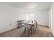 Dining area featuring carpet floors, a center light, and natural light from the window at 1269 Pj East Rd, Covington, GA 30014