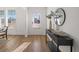 Bright entryway featuring wood floors, a stylish console table, and ample natural light at 1269 Pj East Rd, Covington, GA 30014