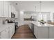 Modern kitchen with white cabinets, stainless steel appliances, and a subway tile backsplash at 1269 Pj East Rd, Covington, GA 30014