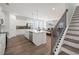 Spacious kitchen with white cabinets, stainless steel appliances, and a large center island at 1269 Pj East Rd, Covington, GA 30014