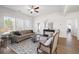 Well-lit living room with a comfortable sofa, stylish decor, and large windows with a view at 1269 Pj East Rd, Covington, GA 30014