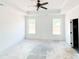 Bright main bedroom featuring tray ceiling and windows providing lots of natural light at 1269 Pj East Rd, Covington, GA 30014