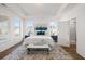 Sun-filled main bedroom with a trey ceiling, ensuite bath, and large windows at 1269 Pj East Rd, Covington, GA 30014