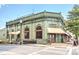 Charming green restaurant building with outdoor seating and a shaded awning at 1269 Pj East Rd, Covington, GA 30014