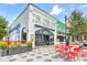 Inviting white brick building featuring City Pharmacy with an outdoor patio and colorful landscaping at 1269 Pj East Rd, Covington, GA 30014