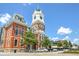 Town square with historic courthouse and street lined with cars on a sunny day at 1269 Pj East Rd, Covington, GA 30014