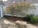 Backyard featuring a small patio with landscaping and trimmed bushes at 134 Rose Cottage Ln, Woodstock, GA 30189