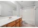 Bathroom with a large vanity, generous countertop space, and a tub-shower combo at 134 Rose Cottage Ln, Woodstock, GA 30189