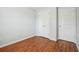 Bedroom featuring light blue walls, wood-style flooring, and closets at 134 Rose Cottage Ln, Woodstock, GA 30189