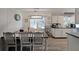 Bright dining area with a modern chandelier and a view of the adjacent kitchen and living spaces at 3948 Lake Carlton Road S Rd, Loganville, GA 30052