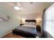 Bright bedroom featuring hardwood floors, neutral walls, and natural light creating a serene and inviting space at 3948 Lake Carlton Road S Rd, Loganville, GA 30052