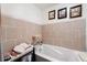 Bathroom featuring a jet tub with tile backsplash and decor around the room at 4648 Danna Dr, Austell, GA 30106