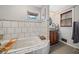 Bathroom featuring a jet tub with a window that provides natural light at 4648 Danna Dr, Austell, GA 30106