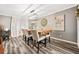 Elegant dining room with modern light fixture, stylish decor, and beautiful wood-look flooring at 4648 Danna Dr, Austell, GA 30106