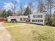 Charming two-story home with a well-maintained lawn and a welcoming red front door at 4648 Danna Dr, Austell, GA 30106