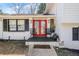 Charming brick home featuring a lovely front entrance with red doors and matching window shutters at 4648 Danna Dr, Austell, GA 30106