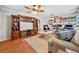 Cozy living room with hardwood floors, comfortable seating, and a decorative ceiling fan at 4648 Danna Dr, Austell, GA 30106