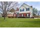 Charming two-story home with brick accents, well-maintained lawn, and mature landscaping at 494 Martin Forest Ln, Lawrenceville, GA 30045