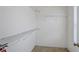 Empty walk-in closet with metal shelving and carpet flooring at 494 Martin Forest Ln, Lawrenceville, GA 30045