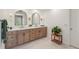 Beautiful bathroom featuring a double vanity, framed mirrors, and stylish fixtures at 7270 Sheffield Pl, Cumming, GA 30040