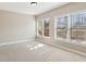 Bedroom with two large windows providing ample natural light at 7270 Sheffield Pl, Cumming, GA 30040