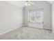 Bright bedroom with vaulted ceilings, neutral colors, and window seat at 7270 Sheffield Pl, Cumming, GA 30040