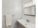 Bathroom features a modern vanity with wood cabinets, white countertop and stylish lighting at 101 Natchez Trce, Atlanta, GA 30350