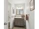 Bathroom featuring gray vanity, stylish mirror, and modern fixtures for a sleek and functional space at 101 Natchez Trce, Atlanta, GA 30350