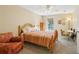 Cozy bedroom with warm colors, a ceiling fan, and a window with natural light at 101 Natchez Trce, Atlanta, GA 30350