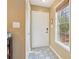 The entryway showcases a decorative tiled floor, a white front door, and a window with natural light at 101 Natchez Trce, Atlanta, GA 30350