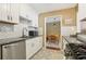 Bright kitchen featuring white cabinets, subway tile backsplash, granite countertops, and stainless steel appliances at 101 Natchez Trce, Atlanta, GA 30350