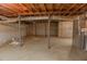 Unfinished basement with concrete walls and floor and exposed ceiling infrastructure at 4042 Shady Nw Cir, Lilburn, GA 30047