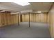 A partially finished basement with paneling and support beams at 4042 Shady Nw Cir, Lilburn, GA 30047