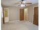 A bedroom featuring an ensuite bathroom with shower visible through the doorway at 4042 Shady Nw Cir, Lilburn, GA 30047