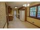 Bright kitchen with a white refrigerator, light-colored floors, and natural lighting at 4042 Shady Nw Cir, Lilburn, GA 30047