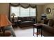 Inviting living room with comfortable seating, a large window, and stylish decor at 4042 Shady Nw Cir, Lilburn, GA 30047