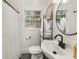 Bright bathroom featuring a window, sink, toilet, and shower with curtain at 410 Wilkinson Se Dr, Atlanta, GA 30317