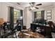 Bright bedroom featuring a ceiling fan, natural light, and a stylish workstation at 410 Wilkinson Se Dr, Atlanta, GA 30317