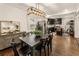 Dining area featuring modern lighting and an open layout to the kitchen at 410 Wilkinson Se Dr, Atlanta, GA 30317