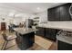 A well-designed kitchen offers black cabinets, granite counters, stainless steel appliances and a breakfast bar at 410 Wilkinson Se Dr, Atlanta, GA 30317