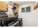 Modern laundry room with updated washer and dryer, cabinetry and décor at 410 Wilkinson Se Dr, Atlanta, GA 30317