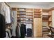 Spacious walk-in closet with custom built-in shelving and drawers for optimal organization and storage at 1421 Peachtree Ne St # 415, Atlanta, GA 30309