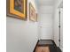 Hallway featuring artwork and a clean aesthetic, leading to various rooms within the home at 1421 Peachtree Ne St # 415, Atlanta, GA 30309