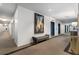 Elegant hallway with carpet, blue elevator doors, art, and modern seating, creating an inviting entrance at 1421 Peachtree Ne St # 415, Atlanta, GA 30309