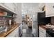 Galley kitchen connecting to the living space, optimizing space and functionality at 1421 Peachtree Ne St # 415, Atlanta, GA 30309