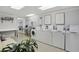 Well-lit laundry room featuring multiple washers and dryers for convenient community use at 1421 Peachtree Ne St # 415, Atlanta, GA 30309