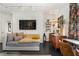 Cozy living room with modern track lighting, stylish decor, and dark hardwood floors at 1421 Peachtree Ne St # 415, Atlanta, GA 30309