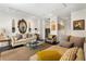 Bright living room featuring modern lighting, decor, and hardwood floors, perfect for entertaining at 1421 Peachtree Ne St # 415, Atlanta, GA 30309